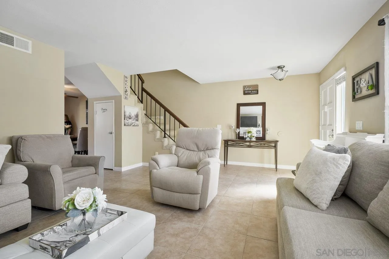 231 Blossom Way Oceanside, CA 92058 - Photo 7 of 31 a living room with furniture and a wooden floor
