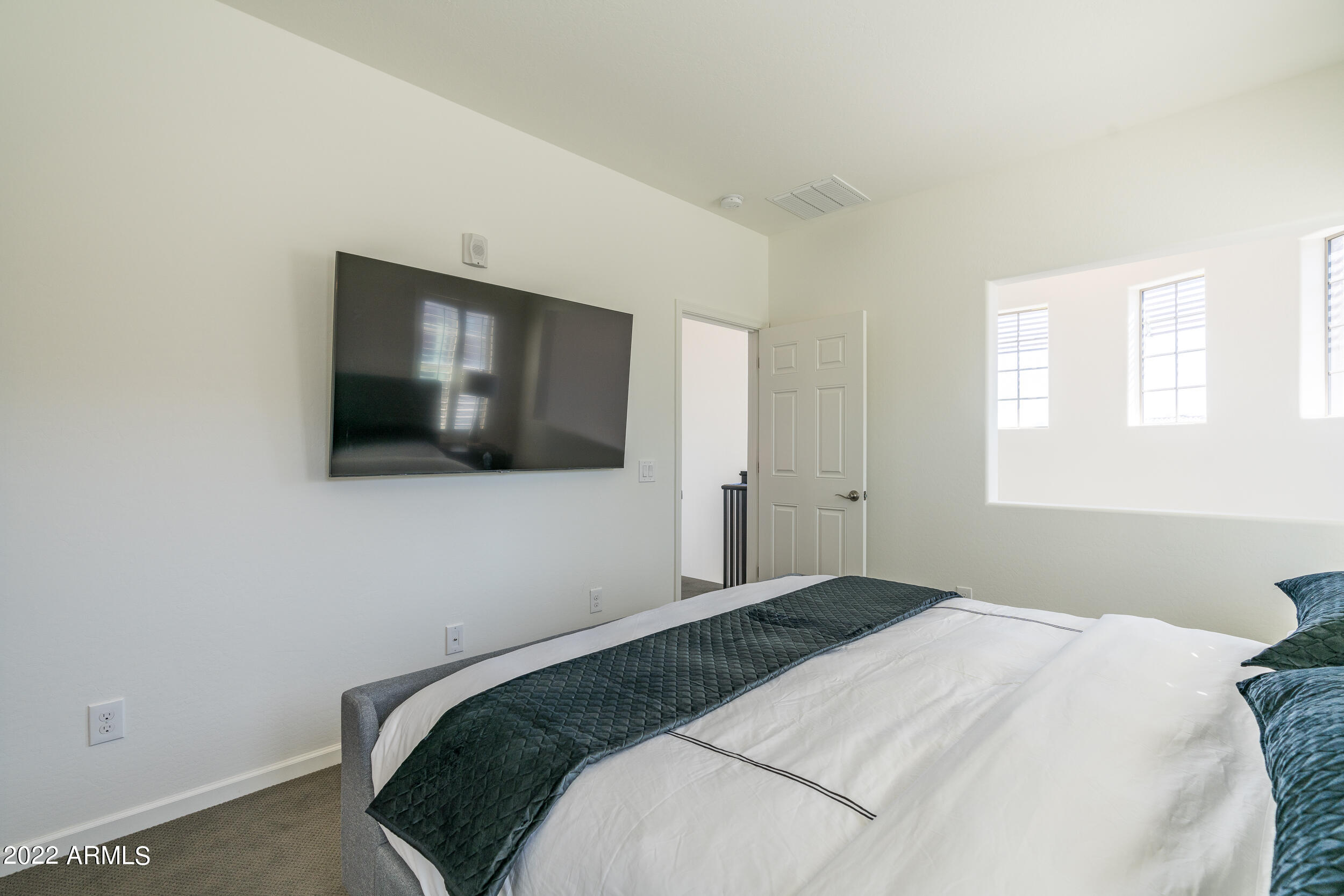 3935 East Rough Rider Road, Unit 1322 Phoenix, AZ 85050 - Photo 13 of 23 Master Bedroom