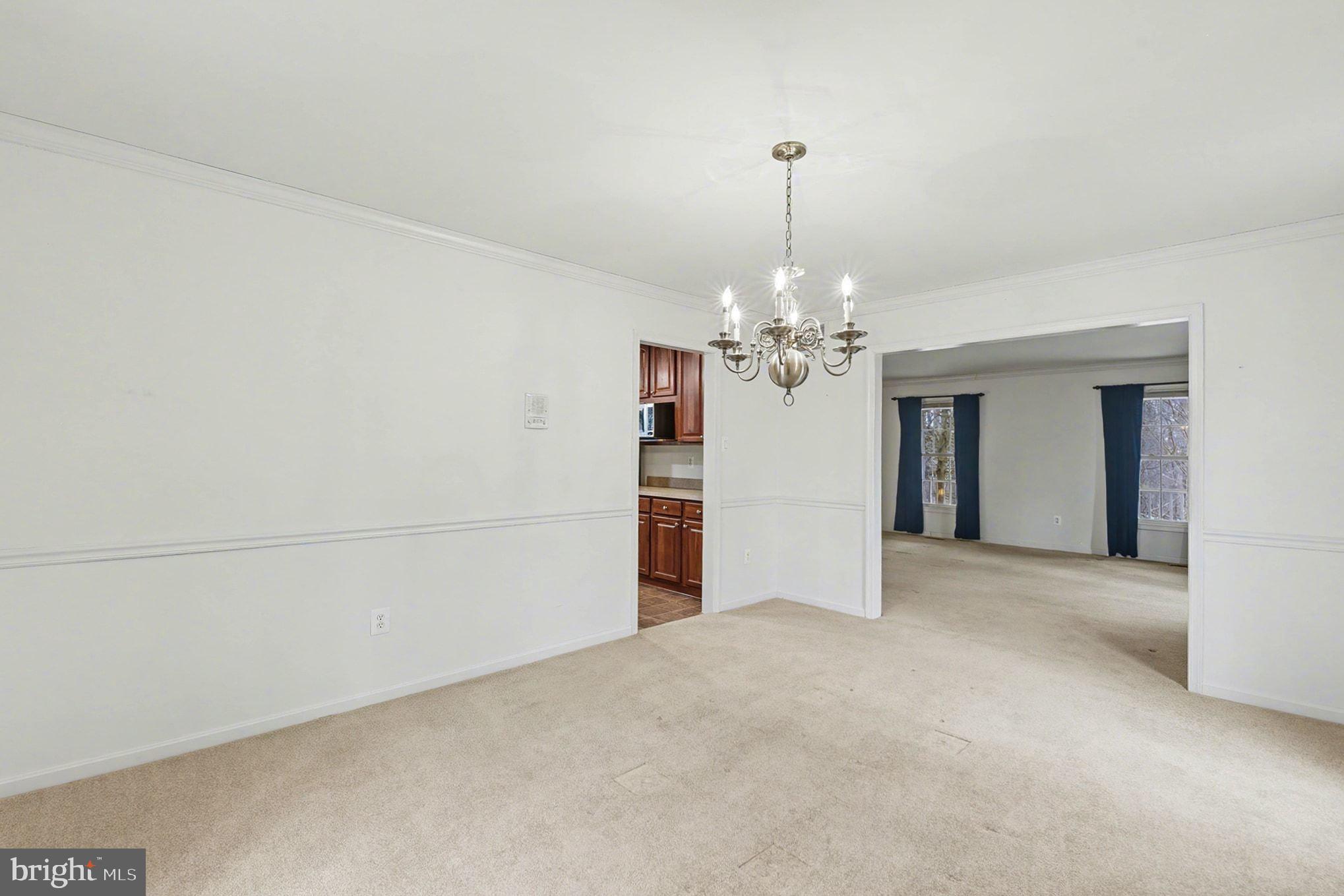 1645 Timber Summit Drive Westminster, MD 21157 - Photo 12 of 52 a view of a chandelier and a chandelier in big room