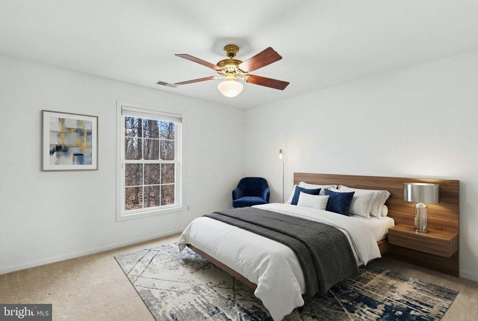 1645 Timber Summit Drive Westminster, MD 21157 - Photo 26 of 52 a bedroom with a large bed and a window