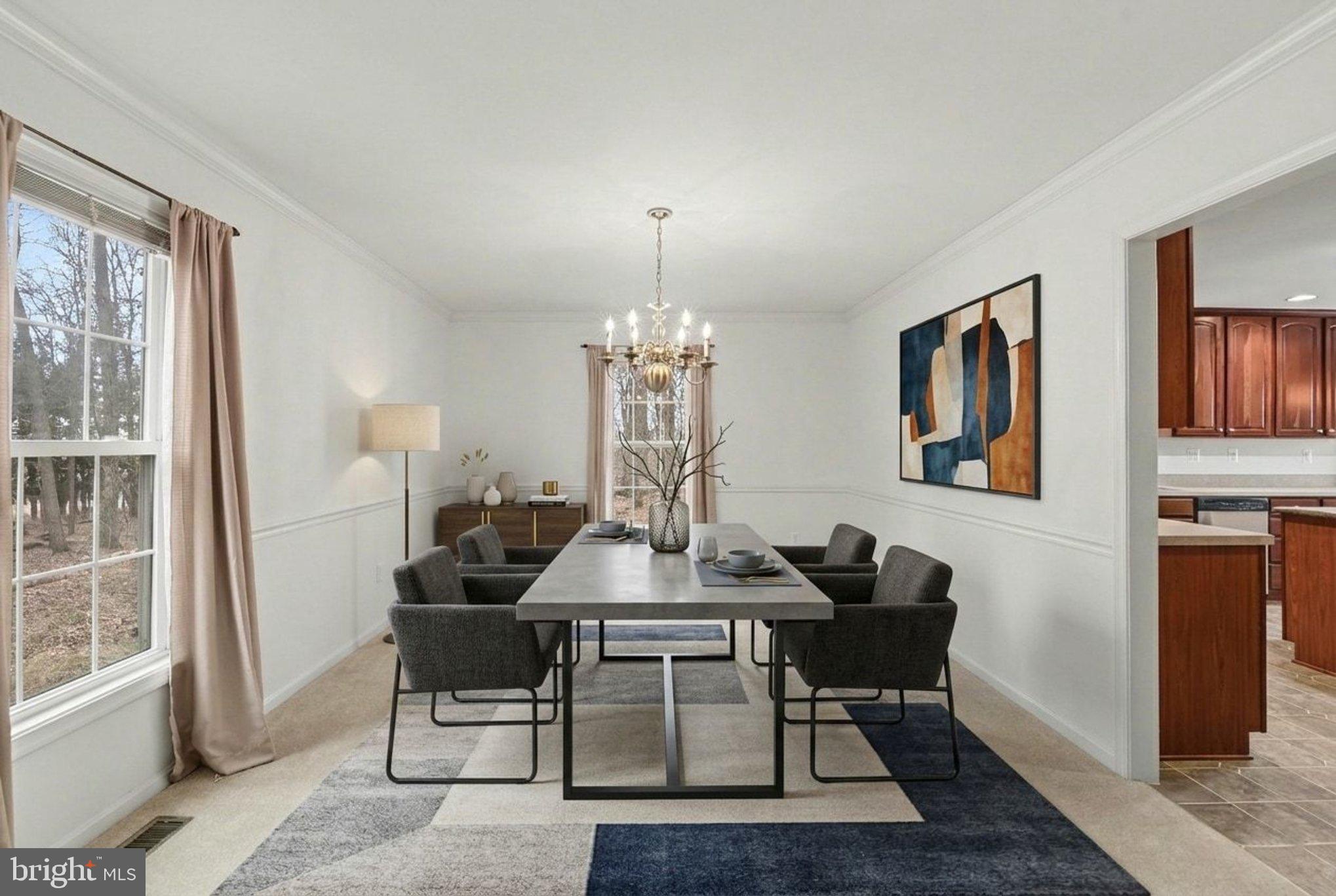 1645 Timber Summit Drive Westminster, MD 21157 - Photo 10 of 52 a view of a dining room with furniture and chandelier