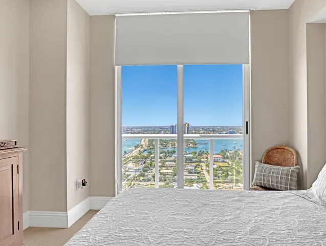 a bedroom with furniture and a flat screen tv