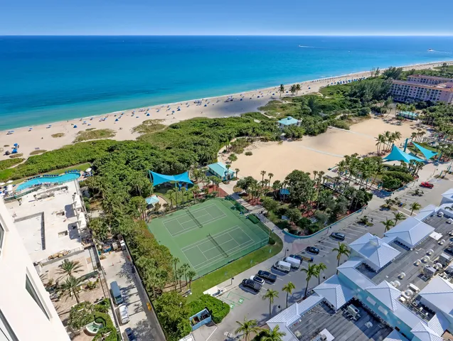 a very nice looking living room with a large dining table and a large window