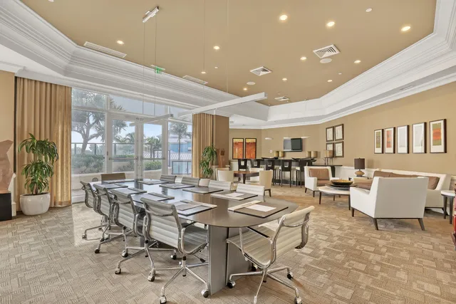 a view of a lake with a table and chairs