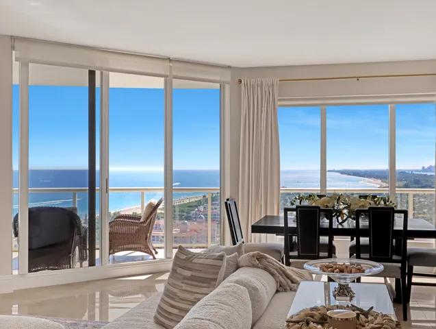 a view of a dining room with furniture and window