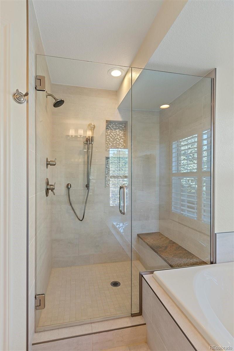 2290 Crestmont Lane Highlands Ranch, CO 80126 - Photo 22 of 40 a bathroom with a granite countertop shower mirror and toilet