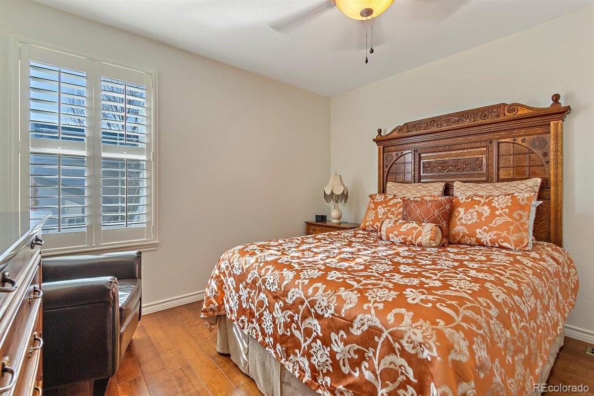 2290 Crestmont Lane Highlands Ranch, CO 80126 - Photo 24 of 40 a bedroom with a bed and window