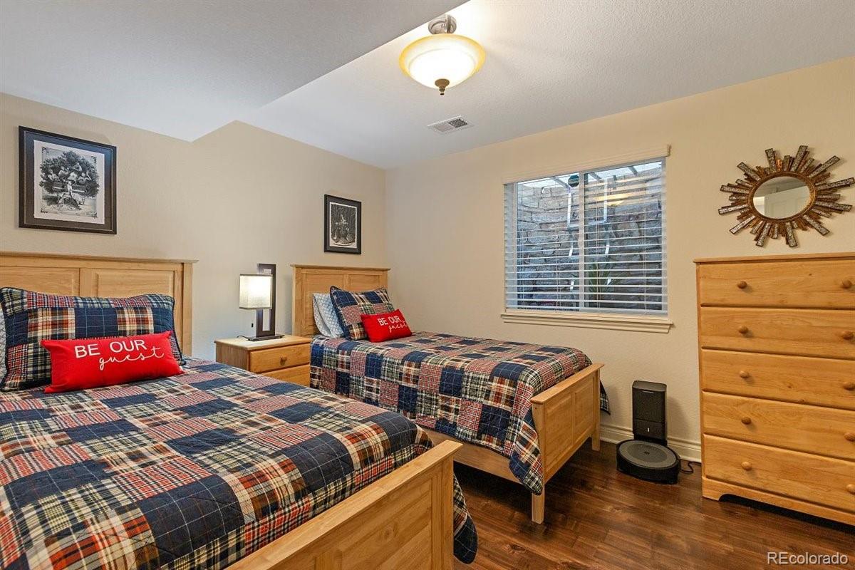 2290 Crestmont Lane Highlands Ranch, CO 80126 - Photo 34 of 40 a bedroom with bed and a window
