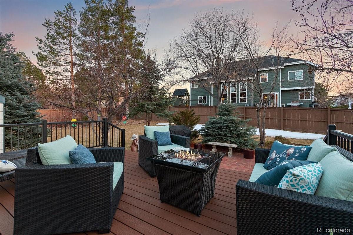 2290 Crestmont Lane Highlands Ranch, CO 80126 - Photo 39 of 40 a view of a roof deck with couches and potted plants