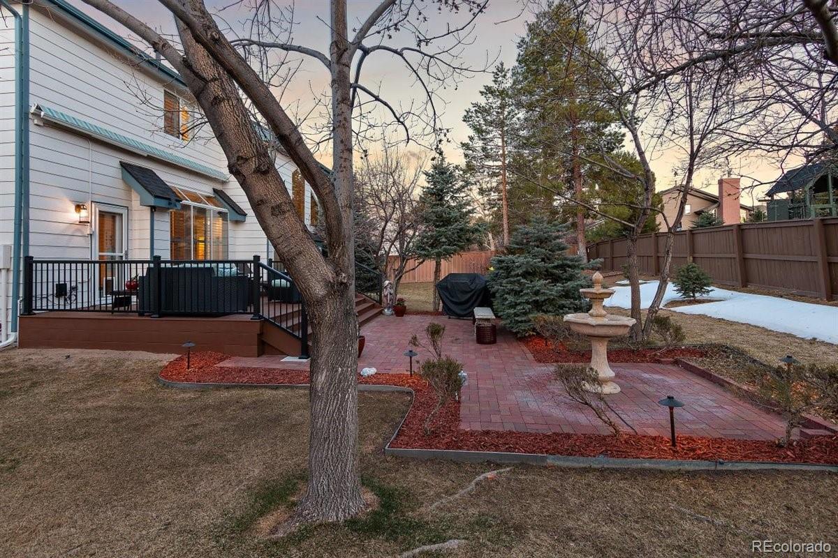 2290 Crestmont Lane Highlands Ranch, CO 80126 - Photo 40 of 40 a view of a yard with a tree
