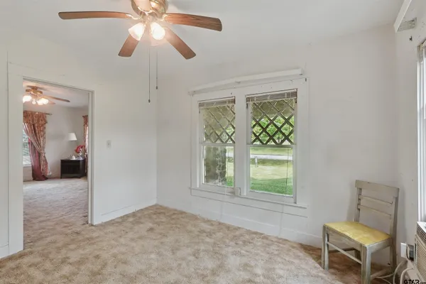 a view of an empty room with a window