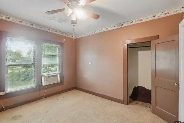 a view of an empty room with a window