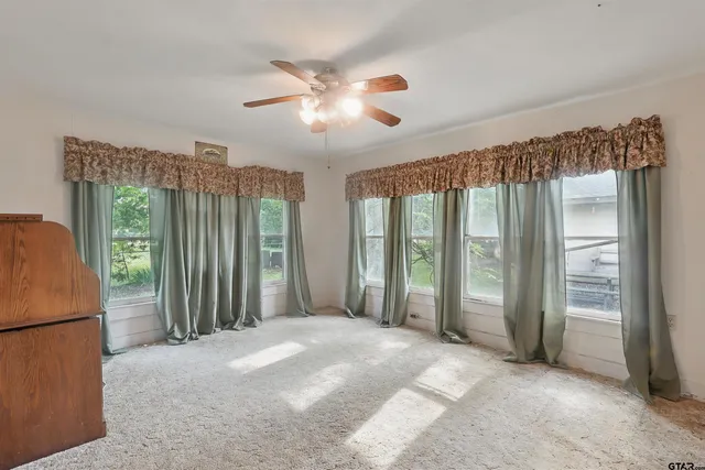 a view of a room with a large window