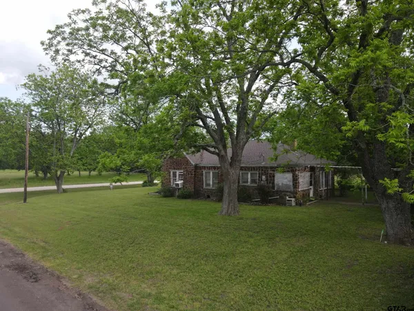 a view of a house with a big yard
