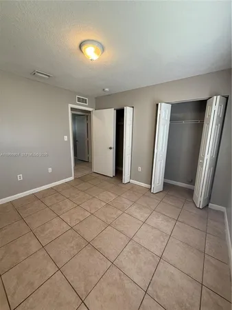 a view of a livingroom with a dishwasher and cabinets