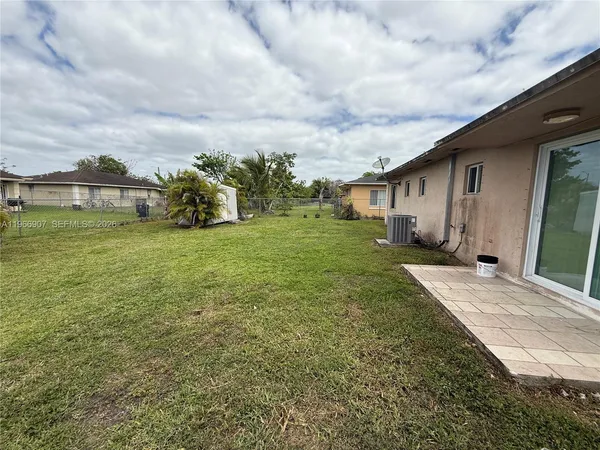 a view of a backyard of the house