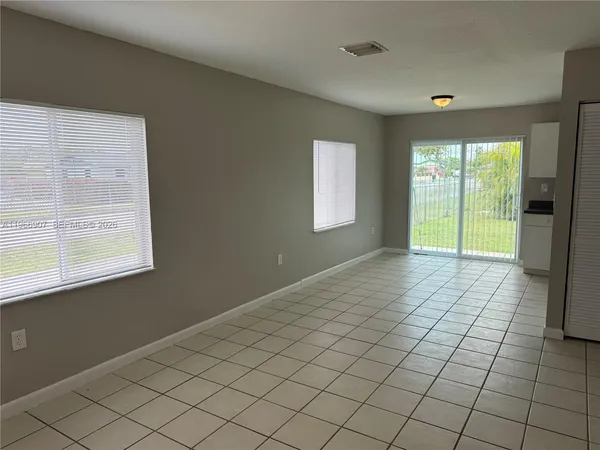 a view of an empty room and window