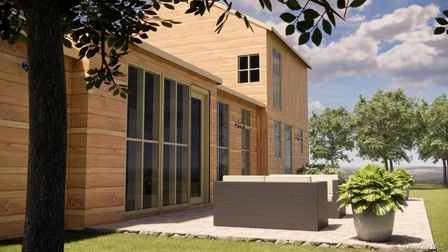 a view of a house with a backyard