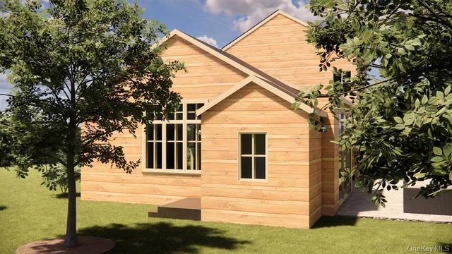 a view of house that has a tree in front