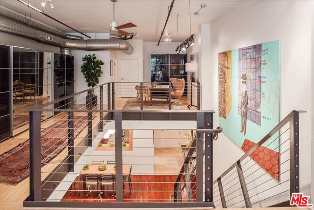 a view of a room with lots of wooden floor