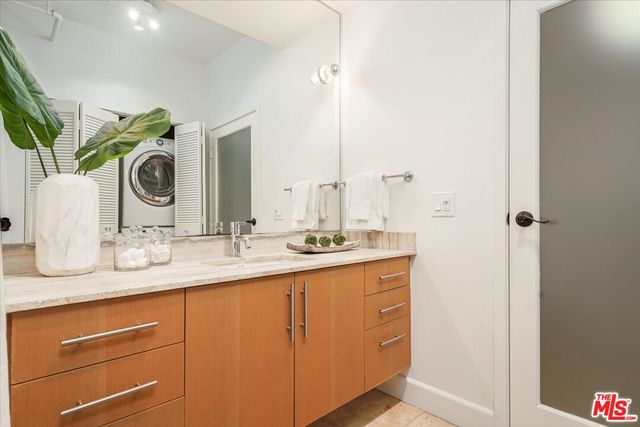 a view of swimming pool with seating area and barbeque oven