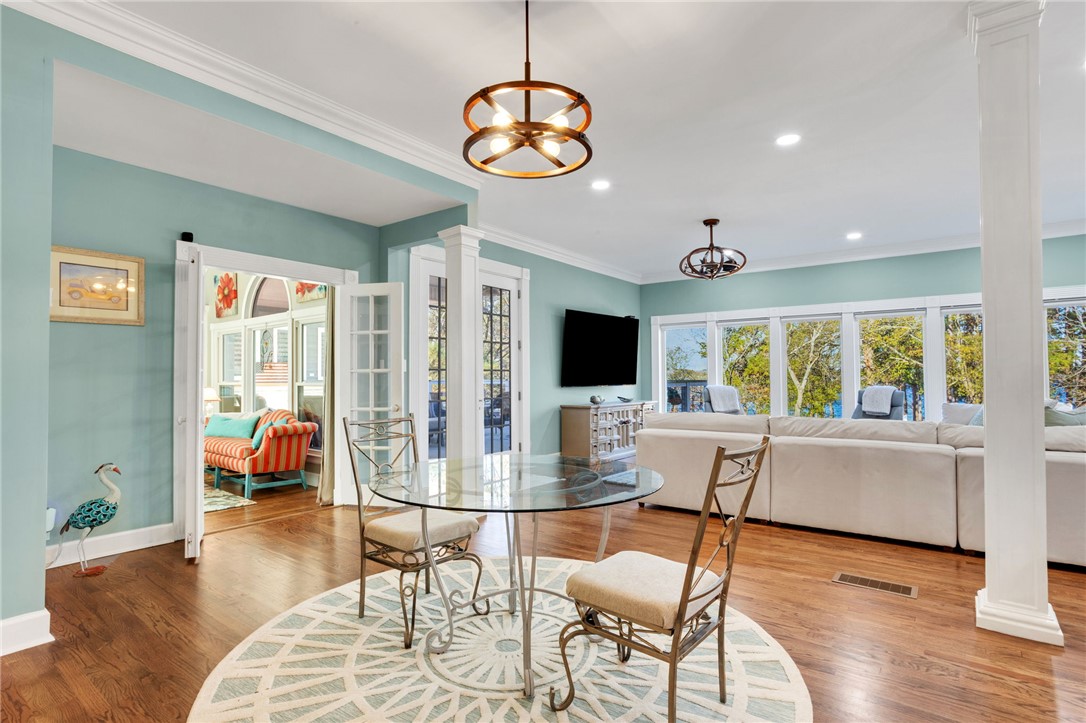 1133 Elrod Ferry Road Hartwell, GA 30643 - Photo 16 of 46 This inviting space offers a seamless transition between dining and relaxation areas with tranquil views.