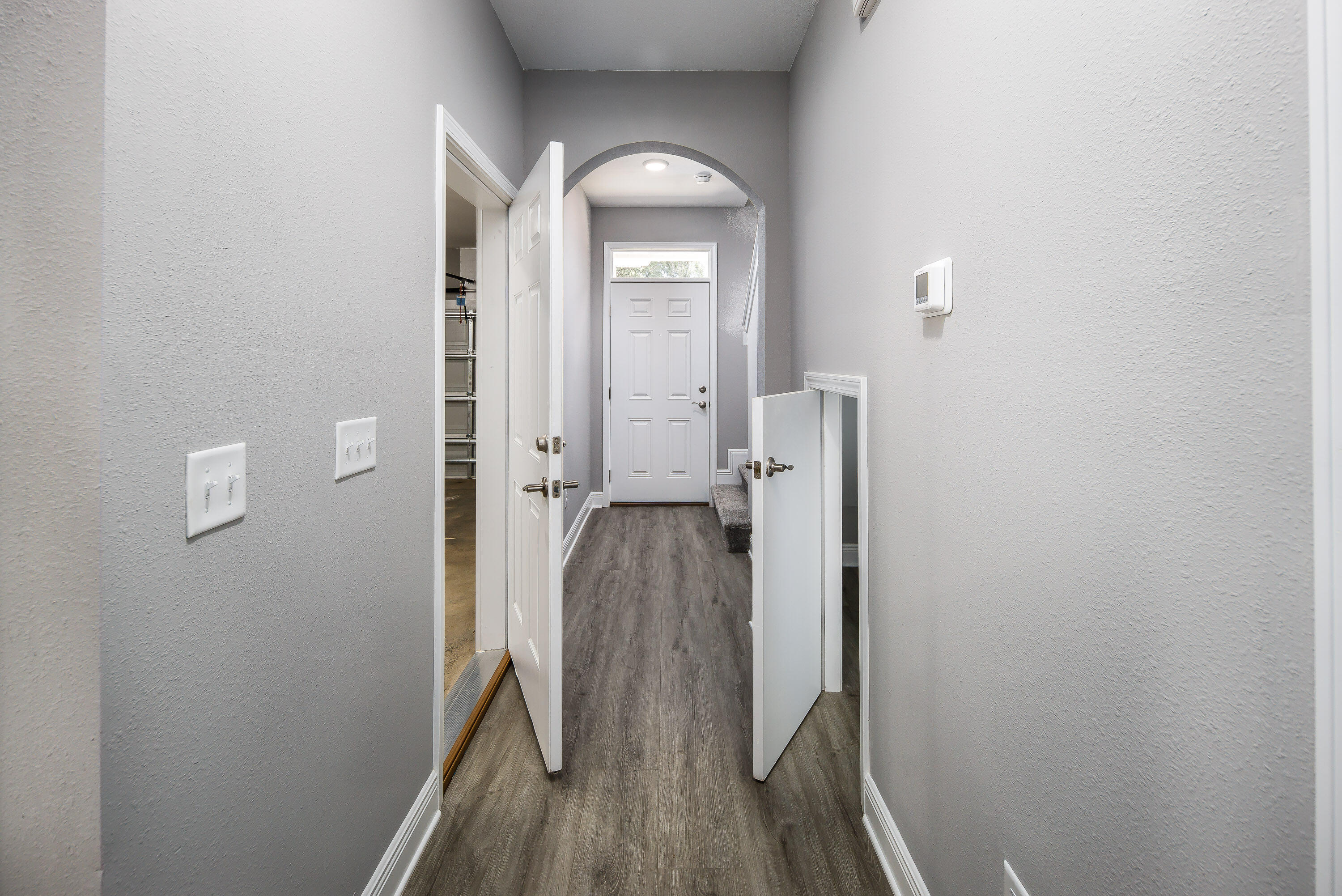 959 Skylark Road Mary Esther, FL 32569 - Photo 13 of 41 a view of a hallway with wooden floor and staircase