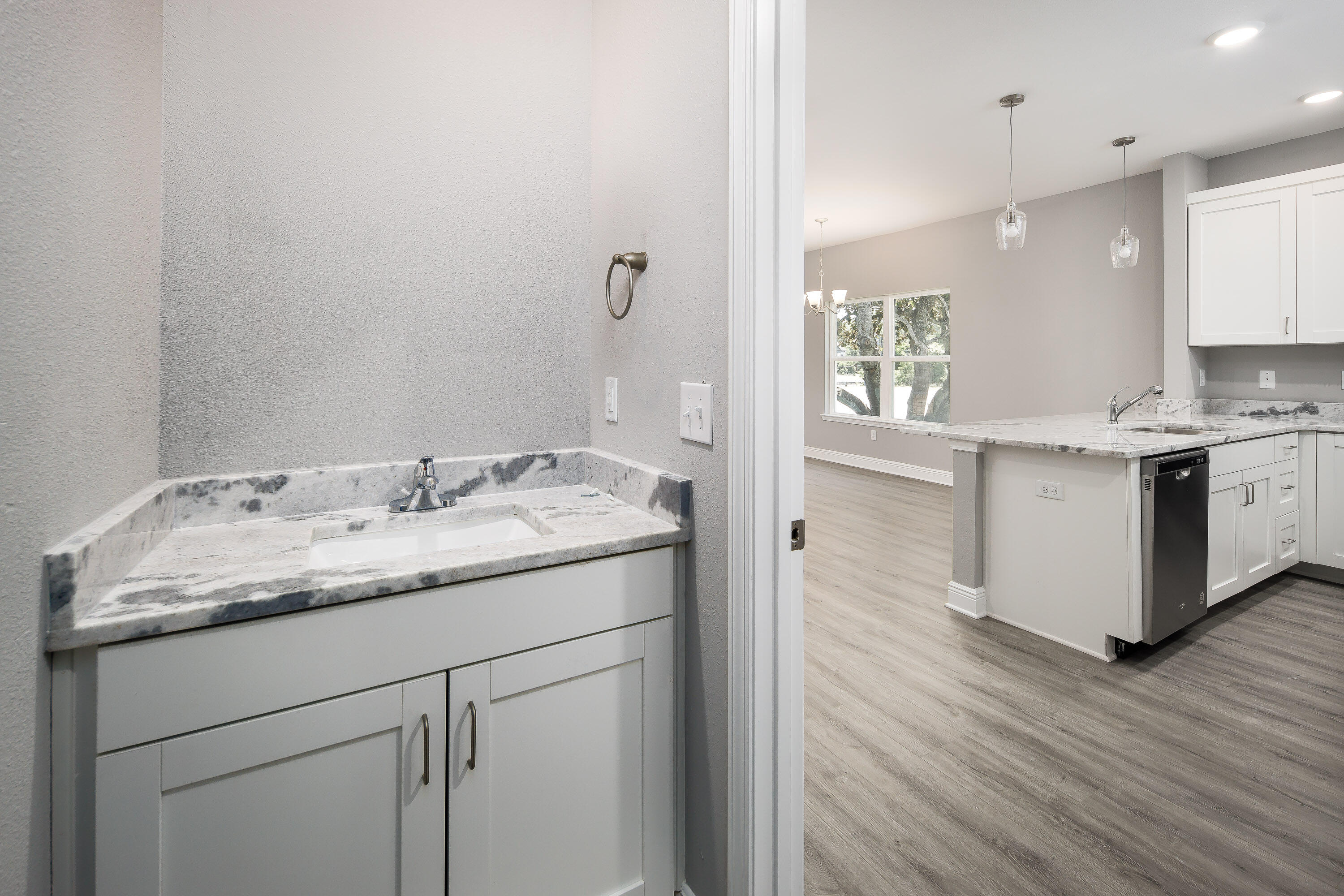 959 Skylark Road Mary Esther, FL 32569 - Photo 18 of 42 a kitchen with a sink cabinets and wooden floor