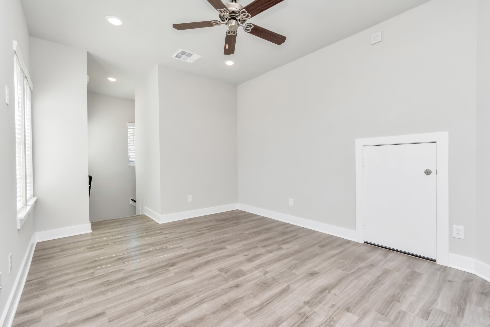 21059 Montego Breeze Lane Cypress, TX 77433 - Photo 14 of 23 an empty room with wooden floor and a ceiling fan