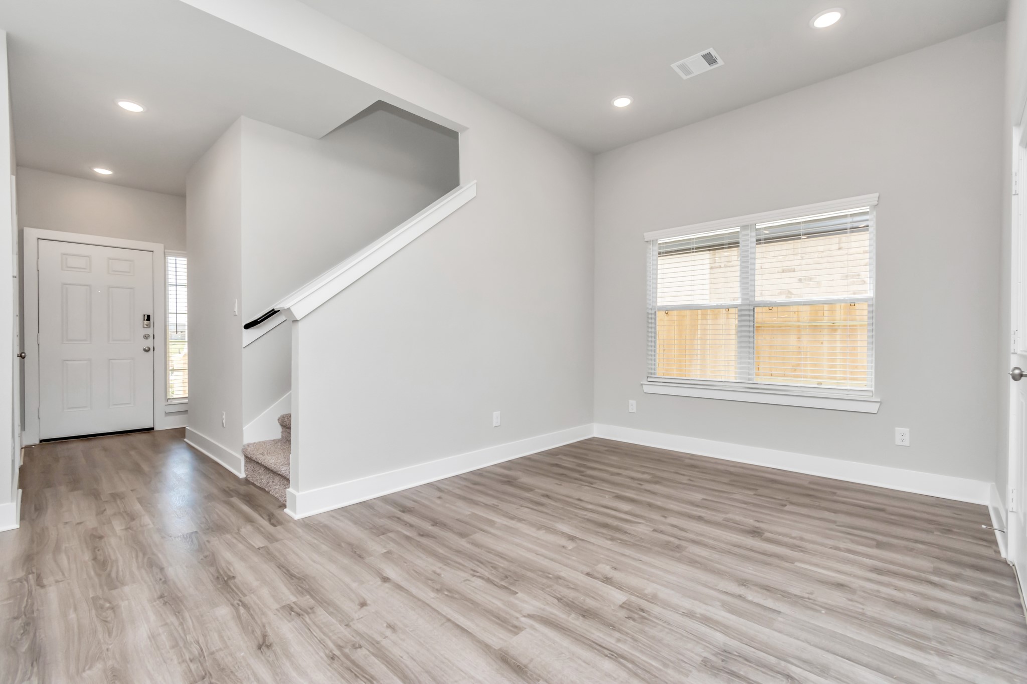 21059 Montego Breeze Lane Cypress, TX 77433 - Photo 5 of 23 an empty room with wooden floor and windows