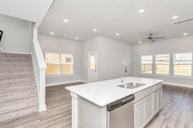 a bathroom with a sink a large mirror and vanity