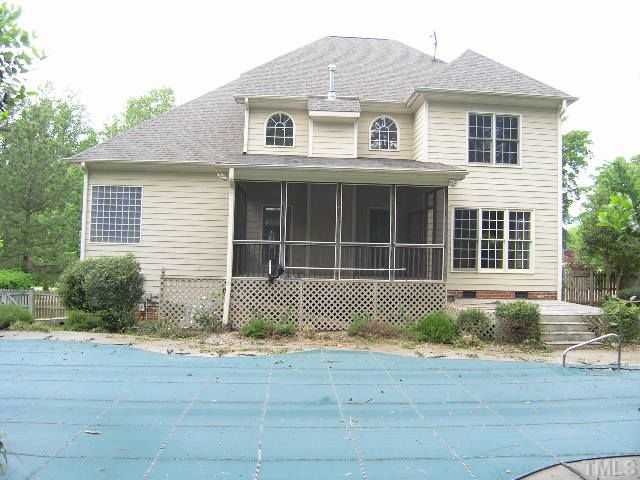 944 Oak Creek Road Raleigh, NC 27615 - Photo 3 of 20 a front view of a house with a garden