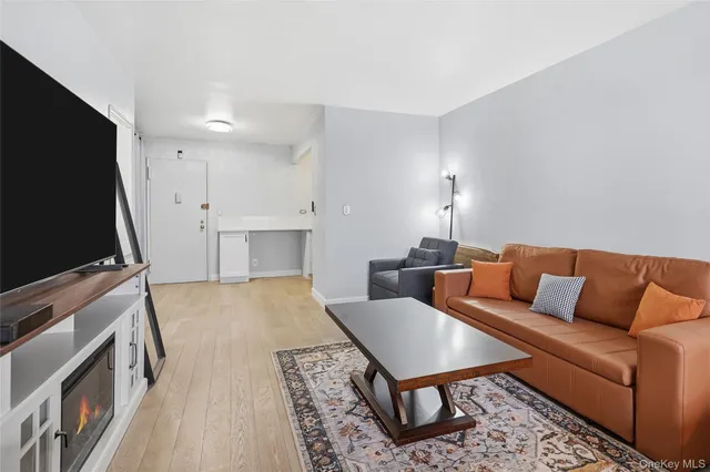 a view of a hallway with furniture and front door