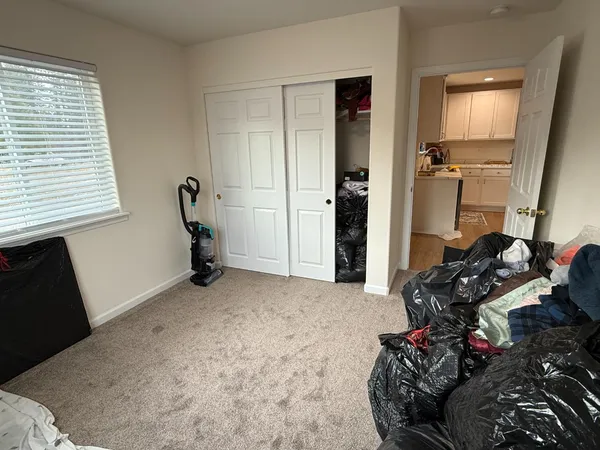 a view of a livingroom with furniture and a window