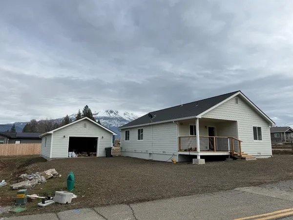 a front view of a house with a yard