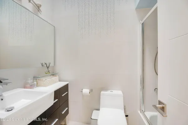 a bathroom with a sink toilet and vanity