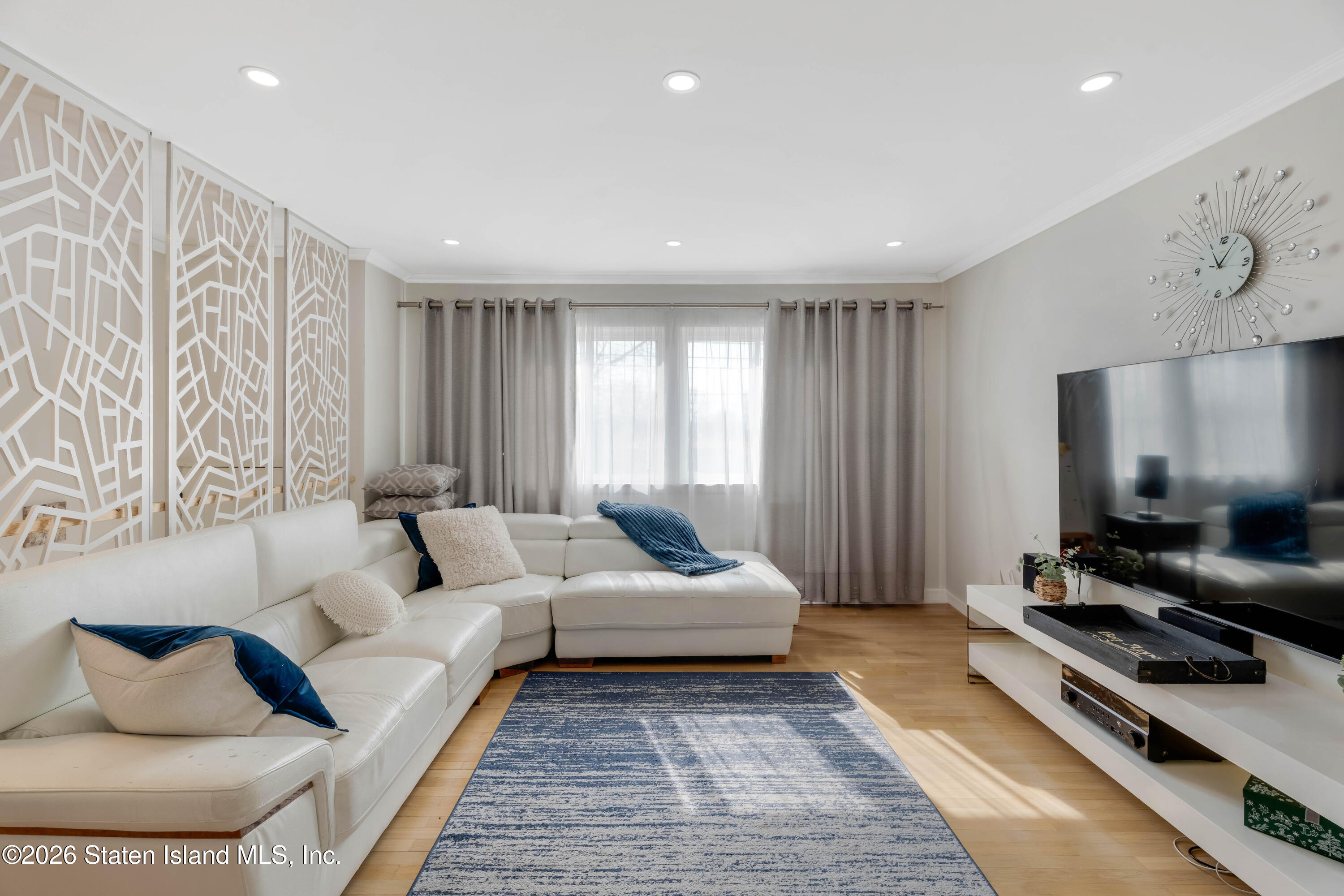 929 West Fingerboard Road Staten Island, NY 10304 - Photo 2 of 14 a living room with furniture and a flat screen tv