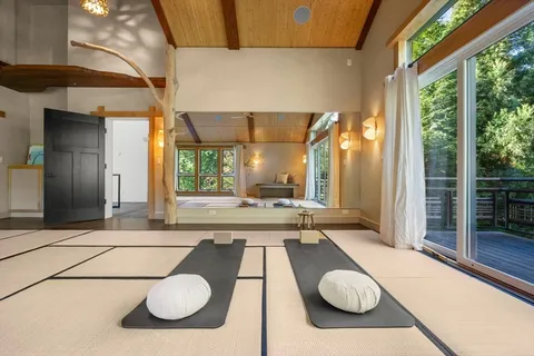 a view of an entryway with wooden floor and stairs