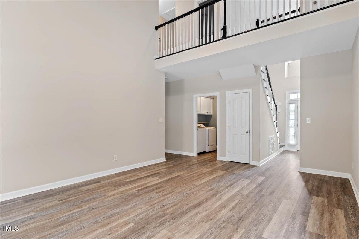 134 Blessed Lane Angier, NC 27501 - Photo 13 of 41 a view of an empty room with wooden floor