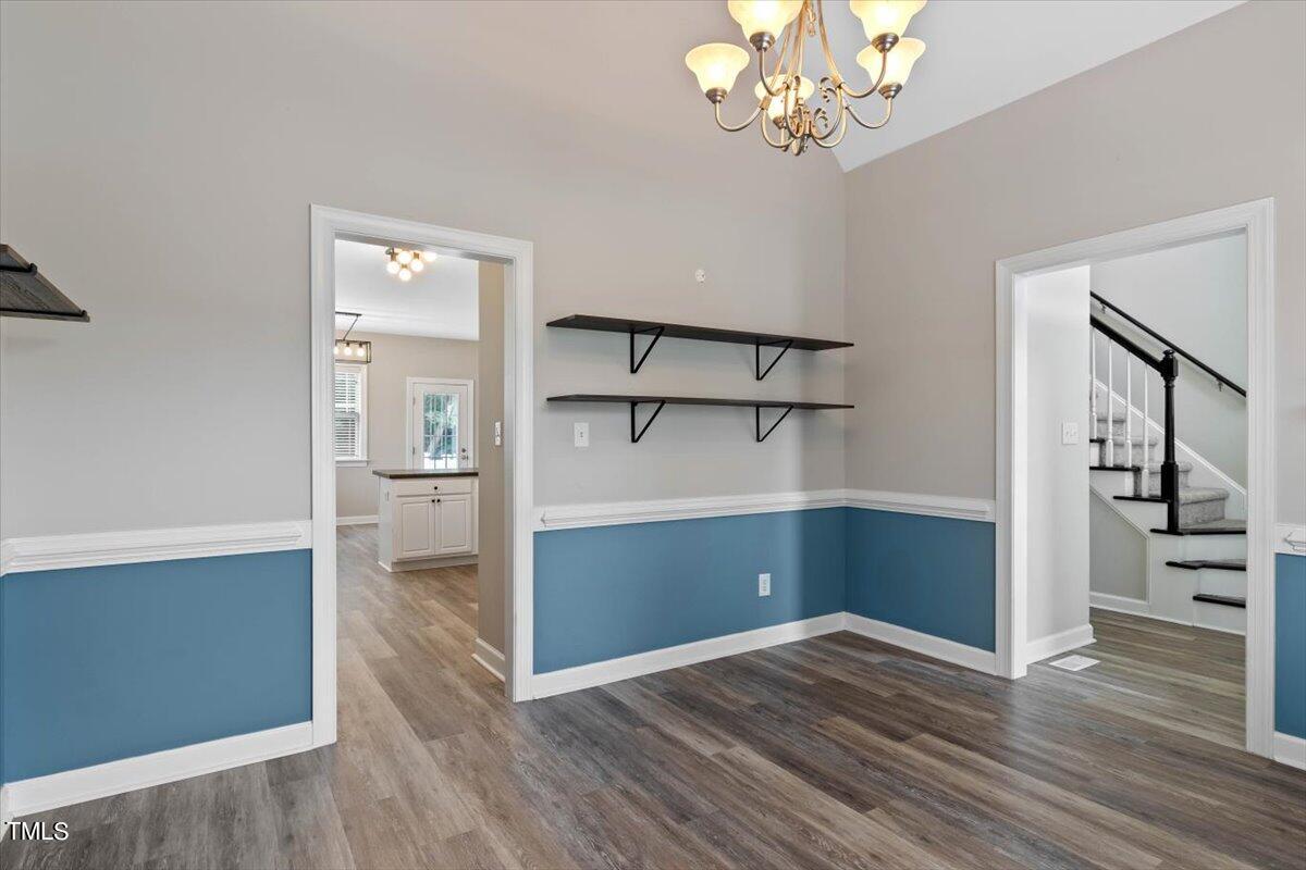 134 Blessed Lane Angier, NC 27501 - Photo 16 of 41 wooden floor in an empty room with a cabinet