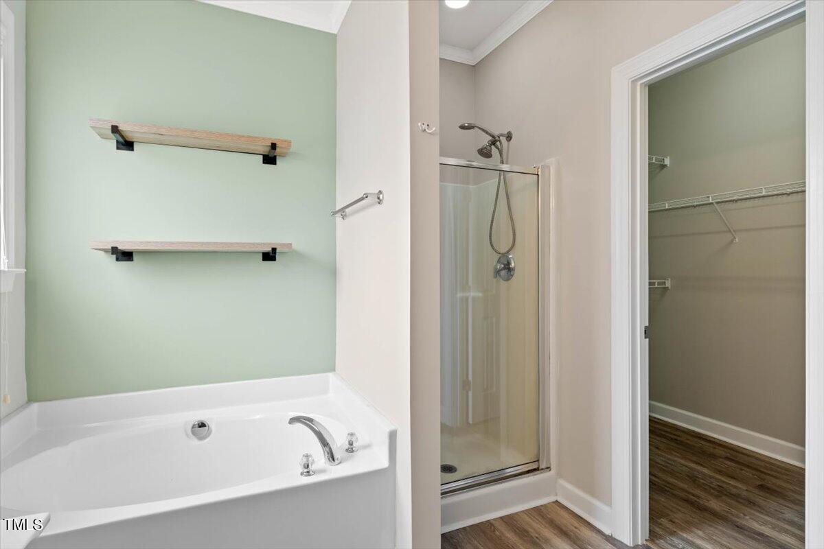 134 Blessed Lane Angier, NC 27501 - Photo 22 of 41 a bathroom with a bathtub and shower