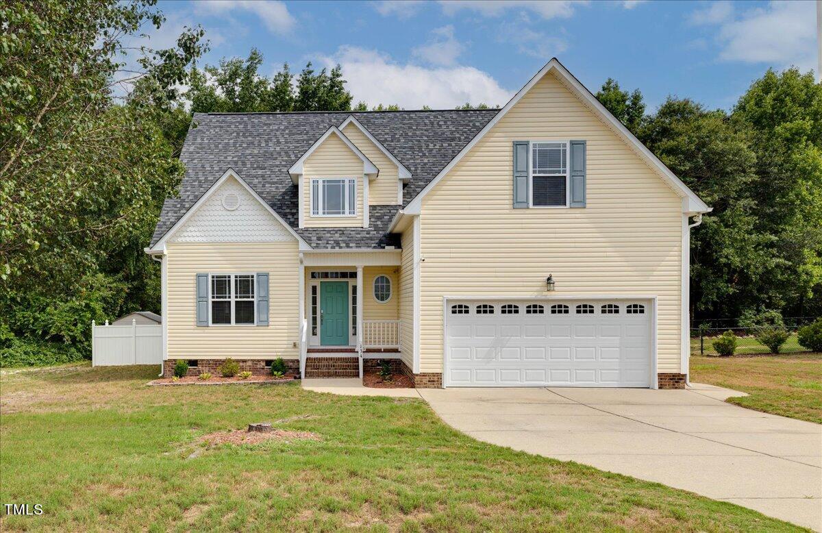 134 Blessed Lane Angier, NC 27501 - Photo 3 of 41 a view of a yard in front of a house with a yard