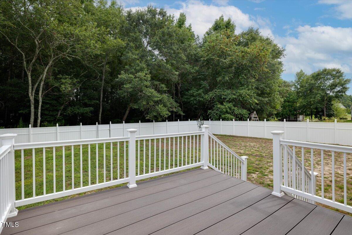 134 Blessed Lane Angier, NC 27501 - Photo 32 of 41 a view of balcony with wooden floor and fence
