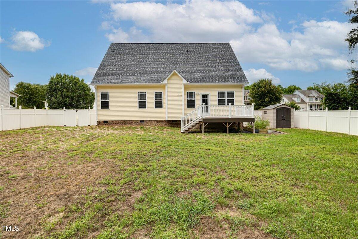 134 Blessed Lane Angier, NC 27501 - Photo 33 of 41 a front view of a house with a garden and yard