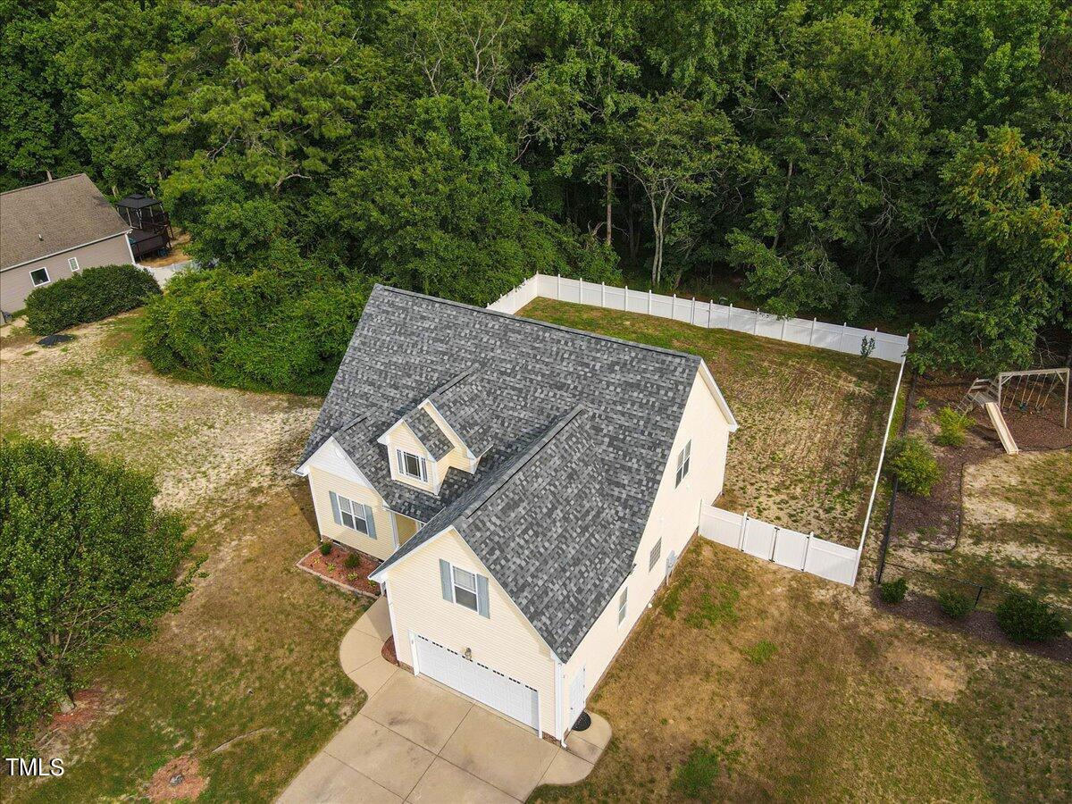 134 Blessed Lane Angier, NC 27501 - Photo 35 of 41 an aerial view of a house with swimming pool