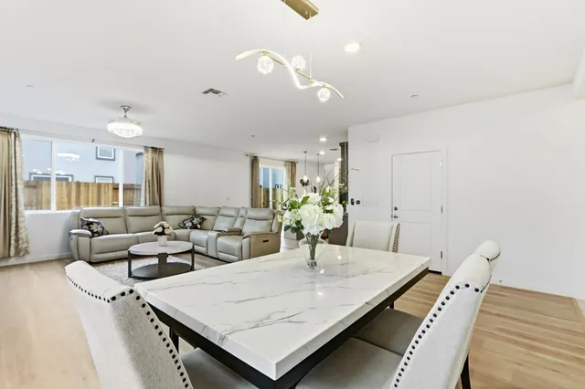 a living room with furniture and a table