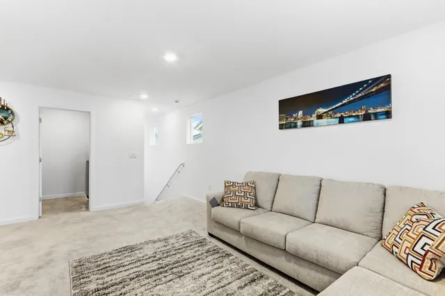 a living room with furniture and a rug