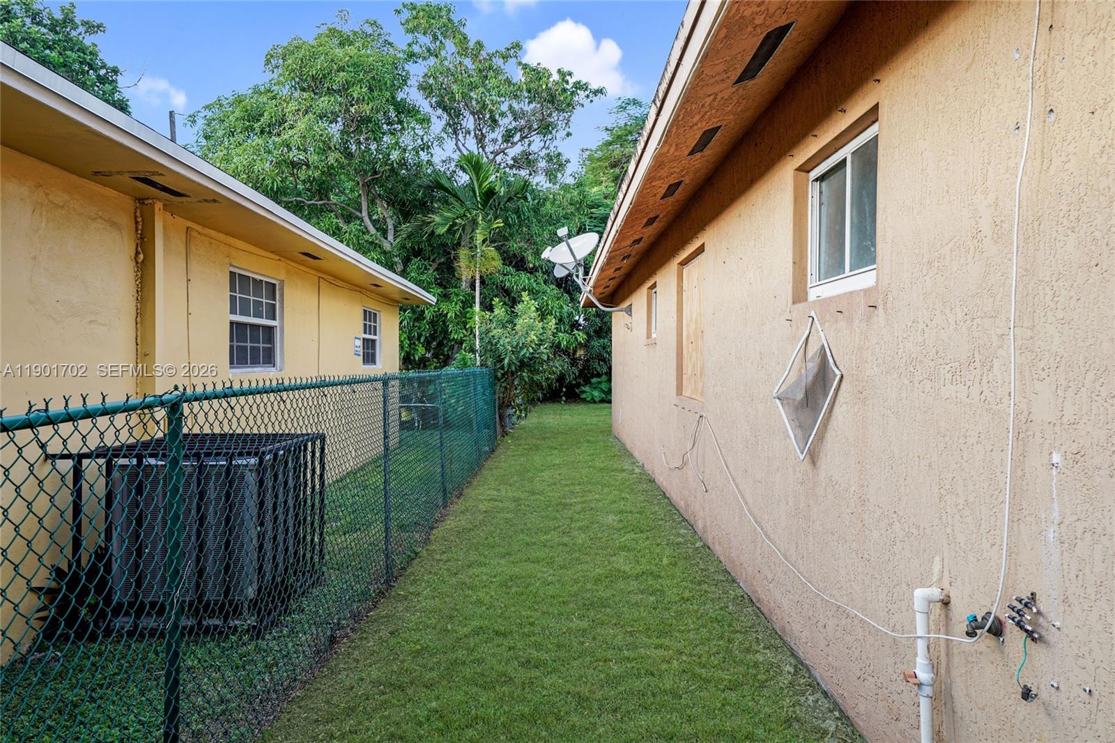 2951 Northwest 57th Street Miami, FL 33142 - Photo 21 of 24 a view of a house with backyard and garden