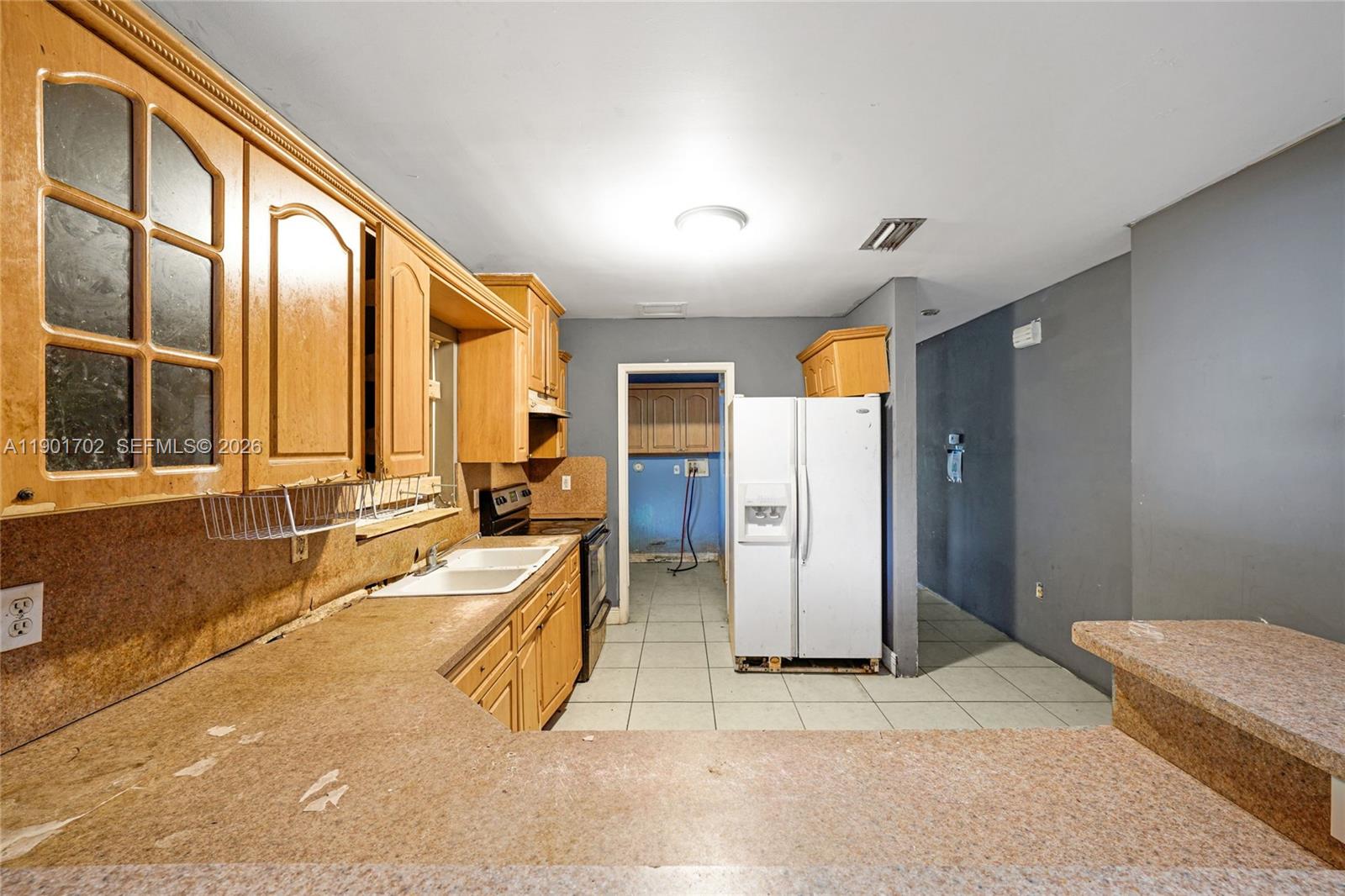 2951 Northwest 57th Street Miami, FL 33142 - Photo 8 of 24 a spacious bathroom with a tub and mirror