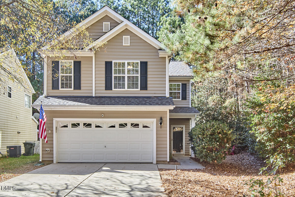 8441 Lunar Stone Place Raleigh, NC 27613 - Photo 3 of 43 a front view of a house with a yard and garage